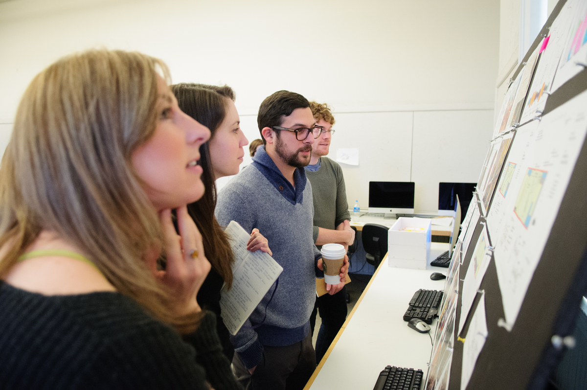 faculty positioned at computers