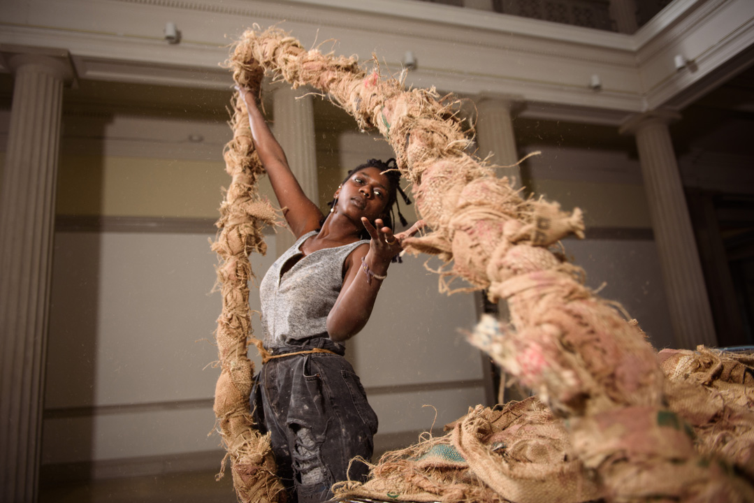 A student works with rope in one of Corcoran's galleries