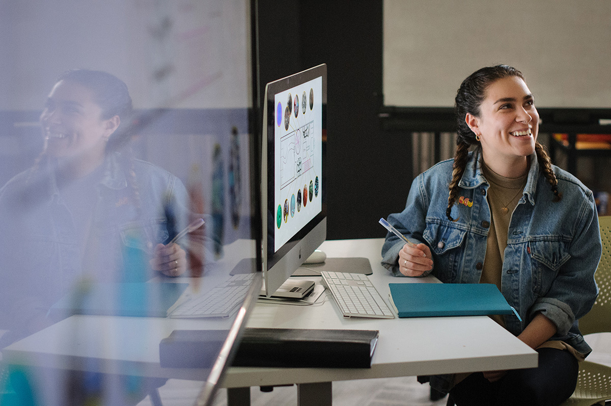 A Corcoran student works with images on a computer